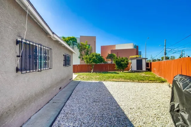 a balcony with furniture and potted plants