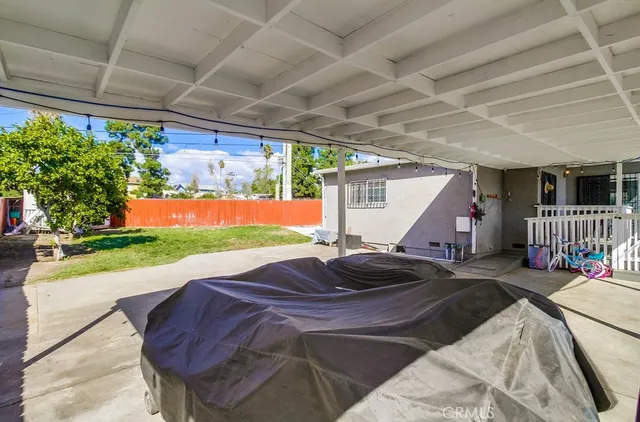 a view of a brick house with a large window