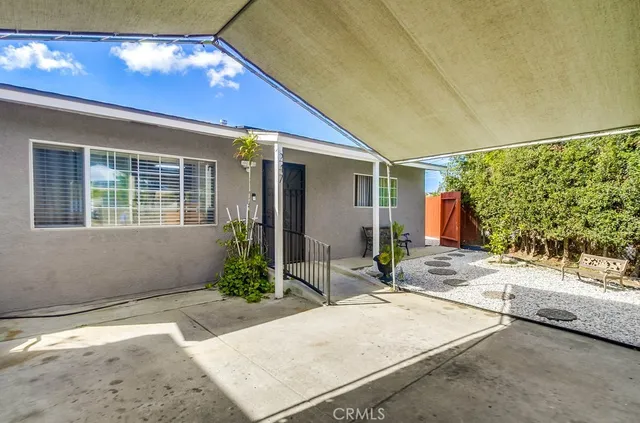 a backyard of a house with seating space
