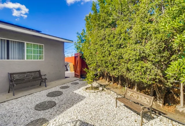 a backyard of a house with seating space