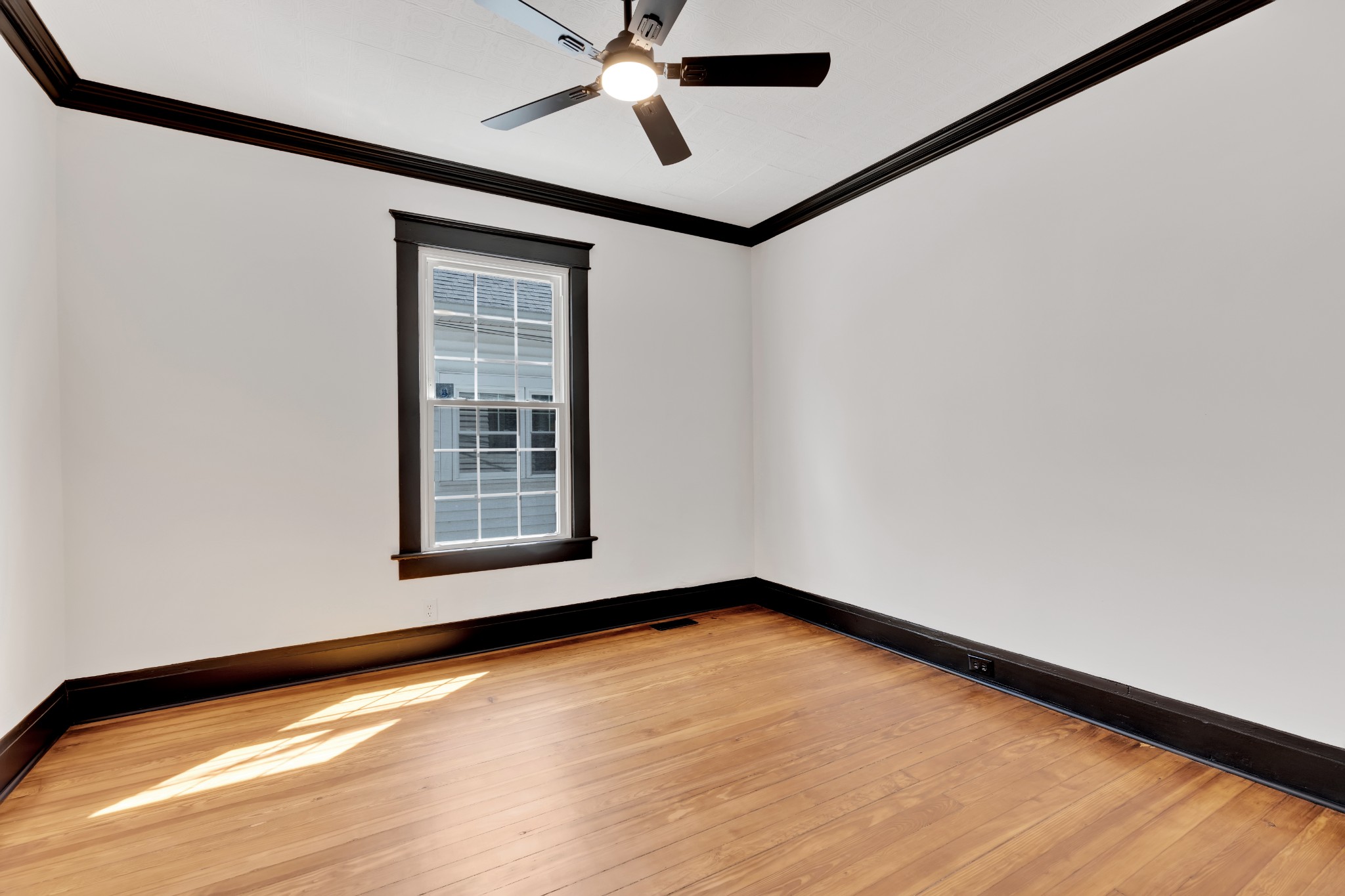 308 North Walnut Street Springfield, TN 37172 - Photo 21 of 35 a view of an empty room with window and wooden floor