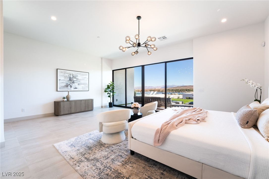 33 Falling Ridge Lane Henderson, NV 89011 - Photo 26 of 70 Bedroom featuring recessed lighting, a chandelier, and a mountain view