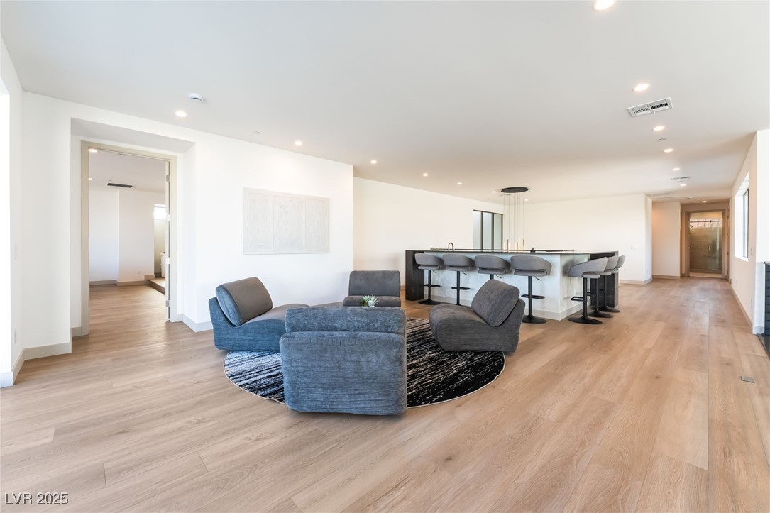 33 Falling Ridge Lane Henderson, NV 89011 - Photo 35 of 70 Living room with light wood-style flooring and recessed lighting