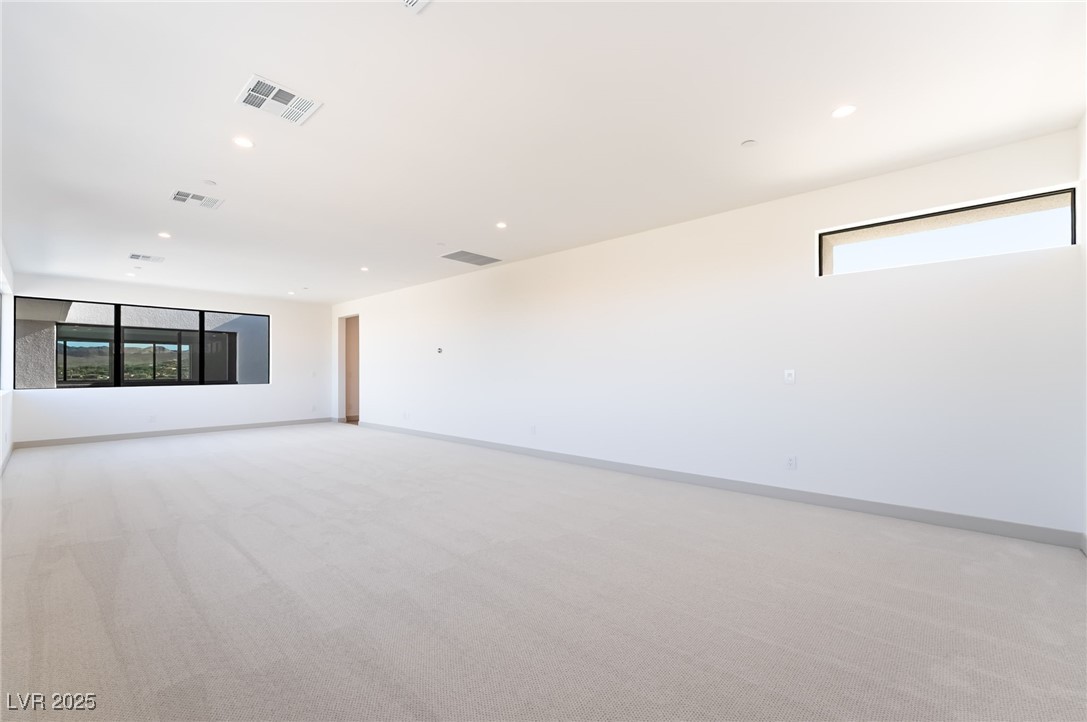 33 Falling Ridge Lane Henderson, NV 89011 - Photo 41 of 70 Unfurnished room featuring light colored carpet and recessed lighting