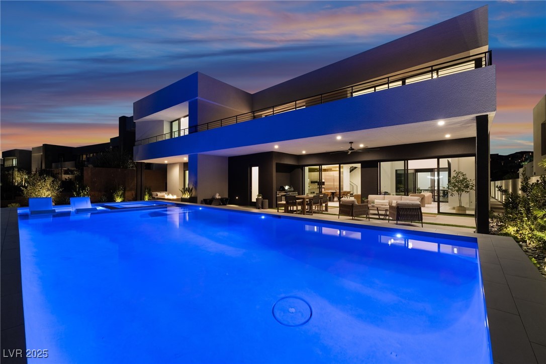 33 Falling Ridge Lane Henderson, NV 89011 - Photo 43 of 70 View of swimming pool featuring an outdoor hangout area, a pool with connected hot tub, and a patio area