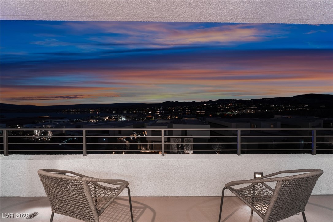 33 Falling Ridge Lane Henderson, NV 89011 - Photo 44 of 70 Patio terrace at dusk with a mountain view and a balcony