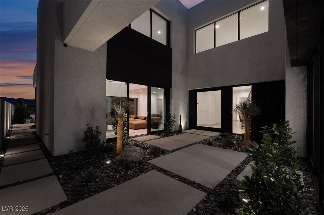 33 Falling Ridge Lane Henderson, NV 89011 - Photo 51 of 70 Doorway to property featuring stucco siding