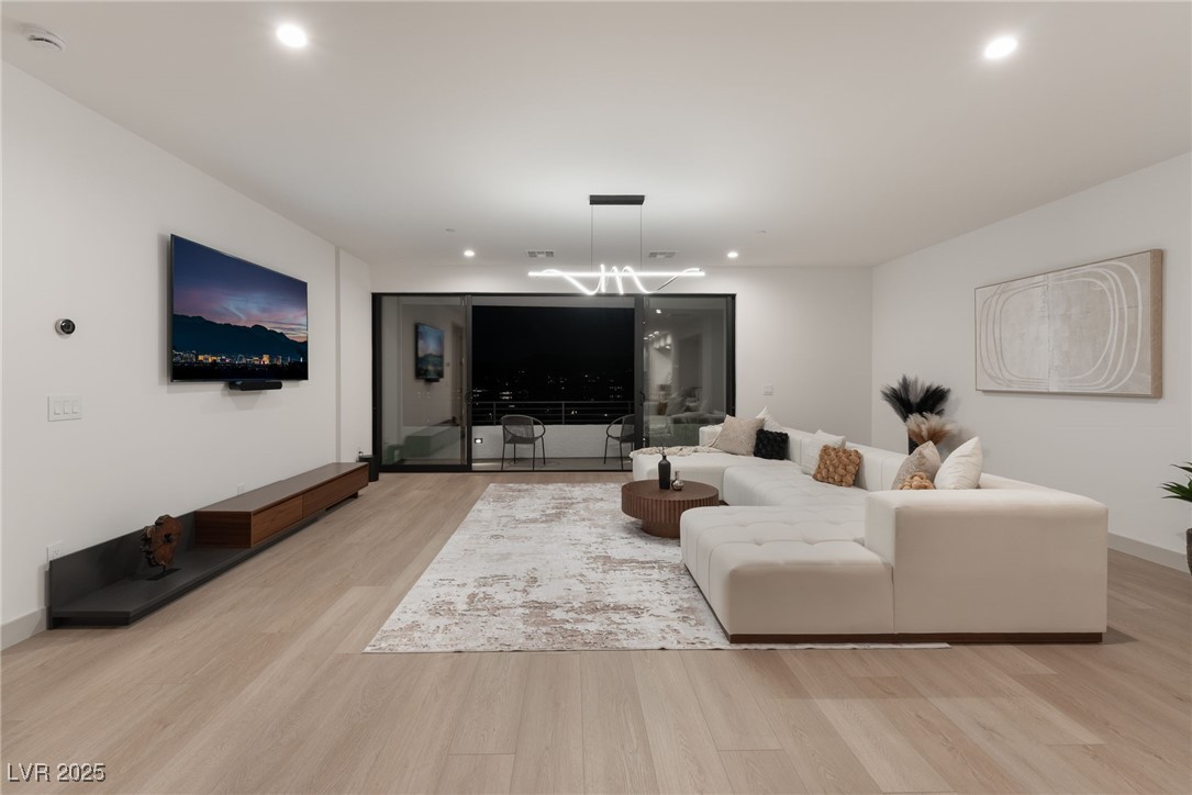 33 Falling Ridge Lane Henderson, NV 89011 - Photo 56 of 70 Living area featuring light wood-type flooring and recessed lighting