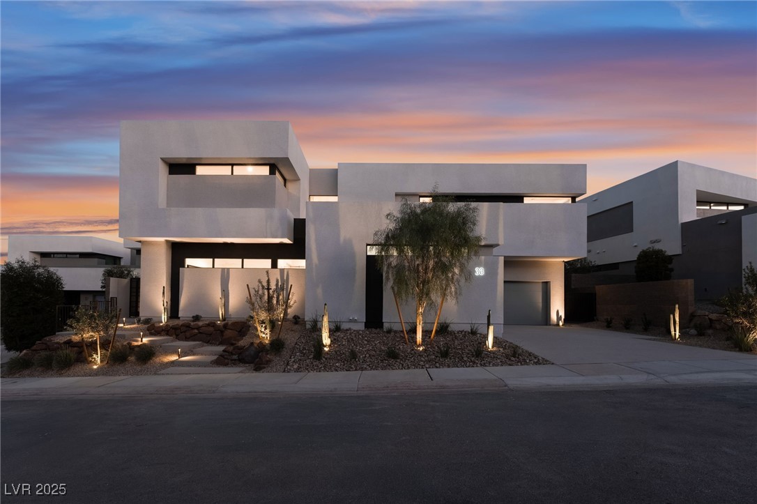 33 Falling Ridge Lane Henderson, NV 89011 - Photo 64 of 70 Contemporary home with stucco siding, concrete driveway, and an attached garage