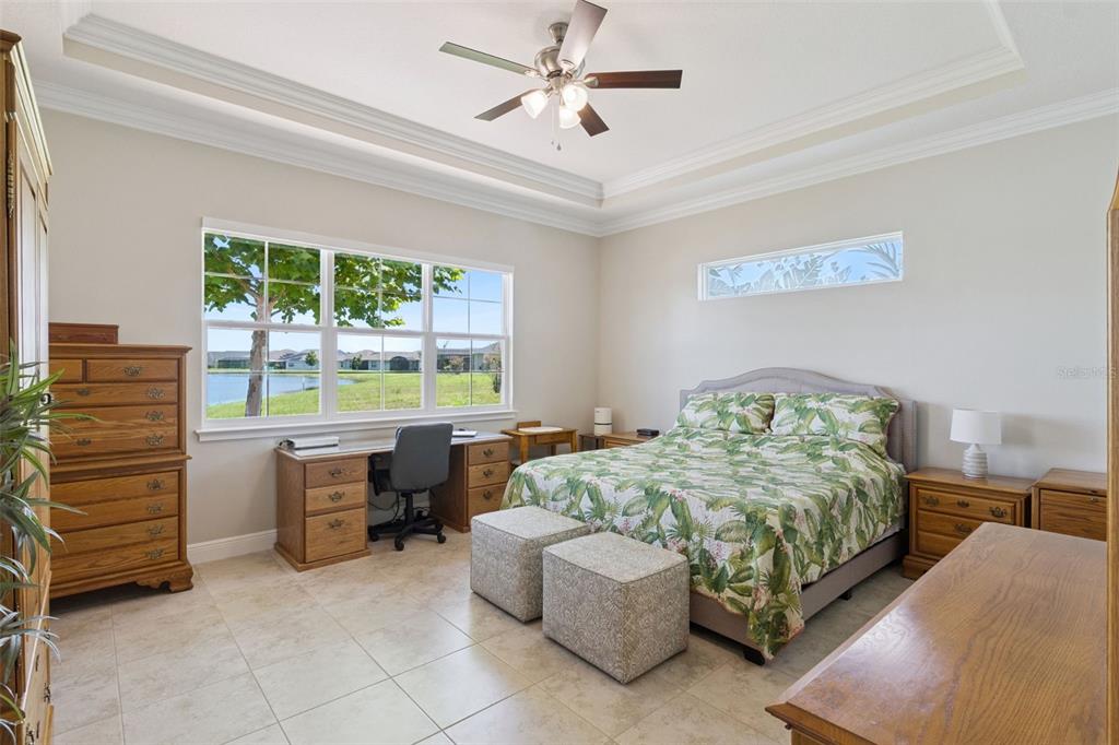 2665 Meadowedge Loop St. Cloud, FL 34772 - Photo 27 of 53 a bedroom with a bed and a table