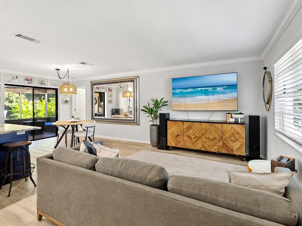 6502 Bikini Way Sarasota, FL 34241 - Photo 11 of 43 a living room with furniture window and wooden floor