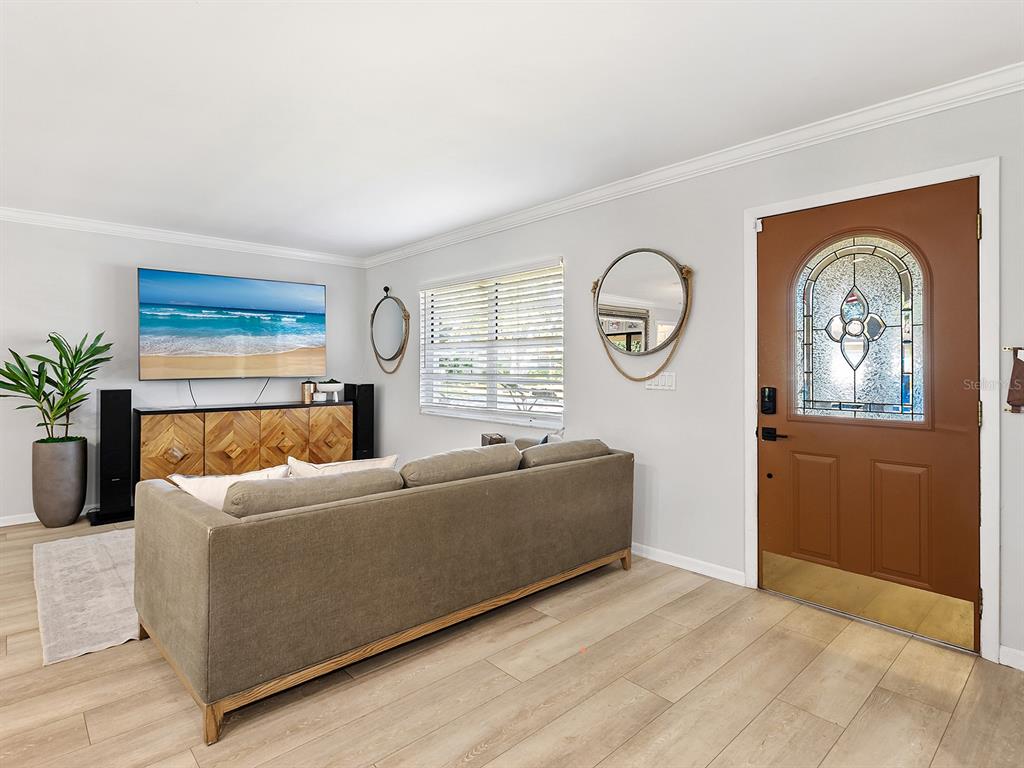 6502 Bikini Way Sarasota, FL 34241 - Photo 12 of 43 a living room with furniture and a window
