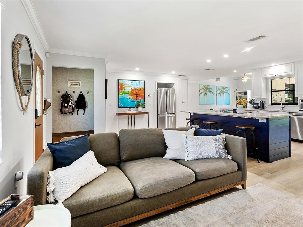 6502 Bikini Way Sarasota, FL 34241 - Photo 13 of 43 a living room with furniture and a flat screen tv