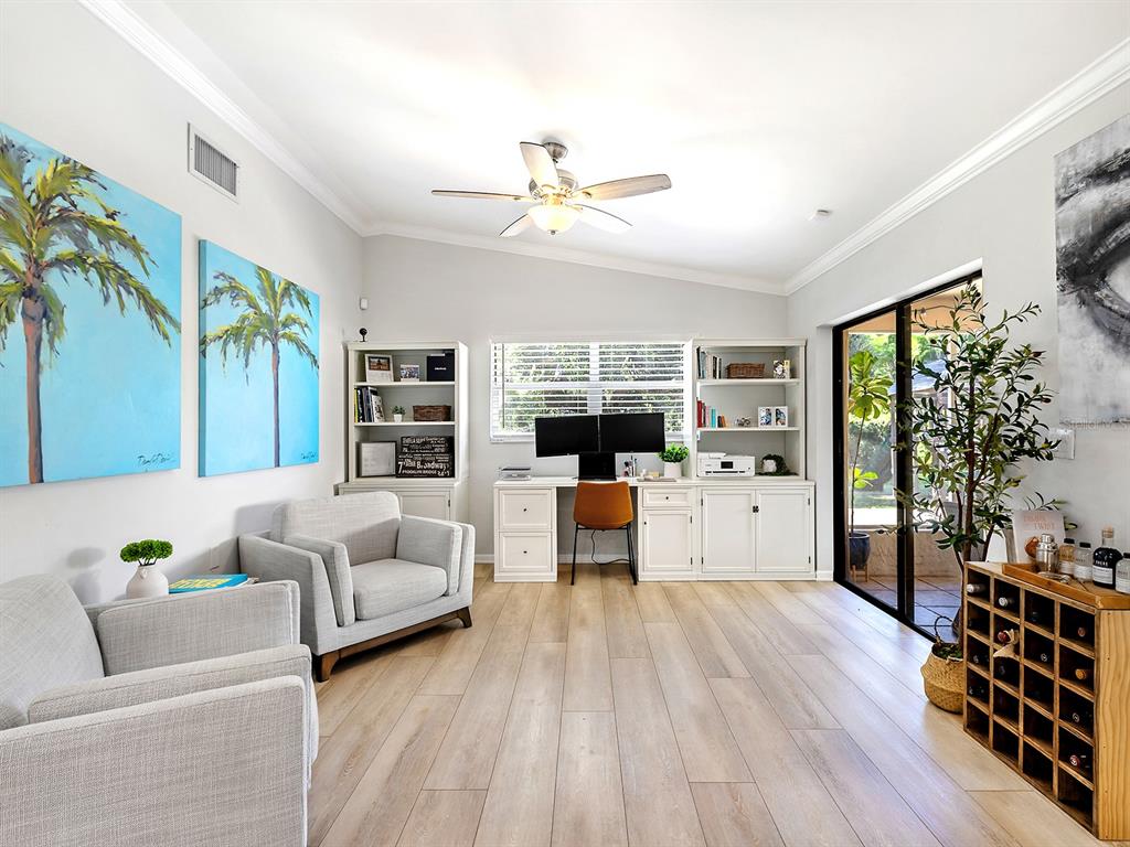 6502 Bikini Way Sarasota, FL 34241 - Photo 16 of 43 a living room with furniture and a large window