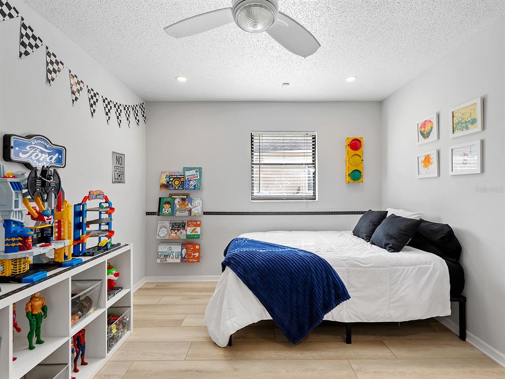 6502 Bikini Way Sarasota, FL 34241 - Photo 22 of 43 a bedroom with a bed and a window