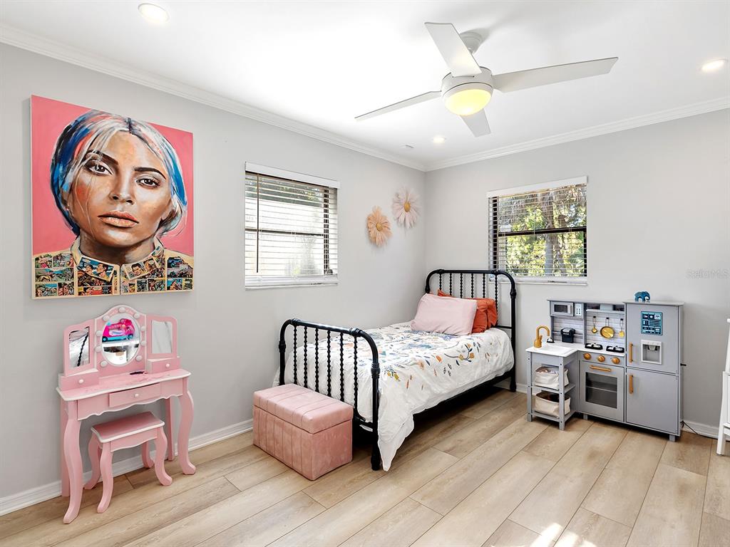 6502 Bikini Way Sarasota, FL 34241 - Photo 24 of 43 a bedroom with furniture and a window