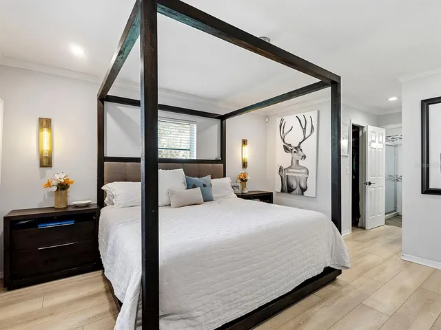 a bedroom with a bed and a dresser