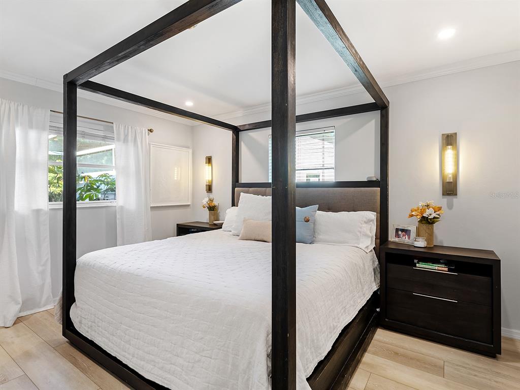 6502 Bikini Way Sarasota, FL 34241 - Photo 26 of 43 a bedroom with a bed and a large window