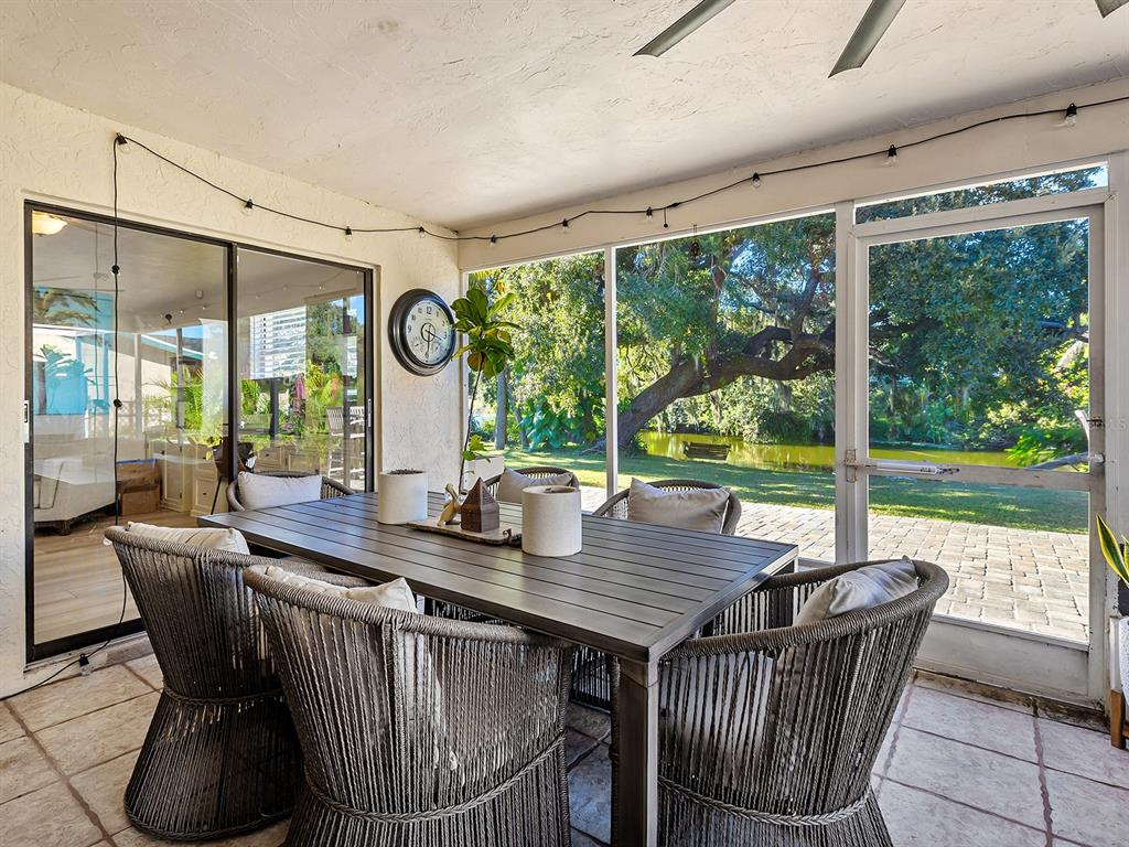 6502 Bikini Way Sarasota, FL 34241 - Photo 28 of 43 a view of a dining room with furniture window and outside view