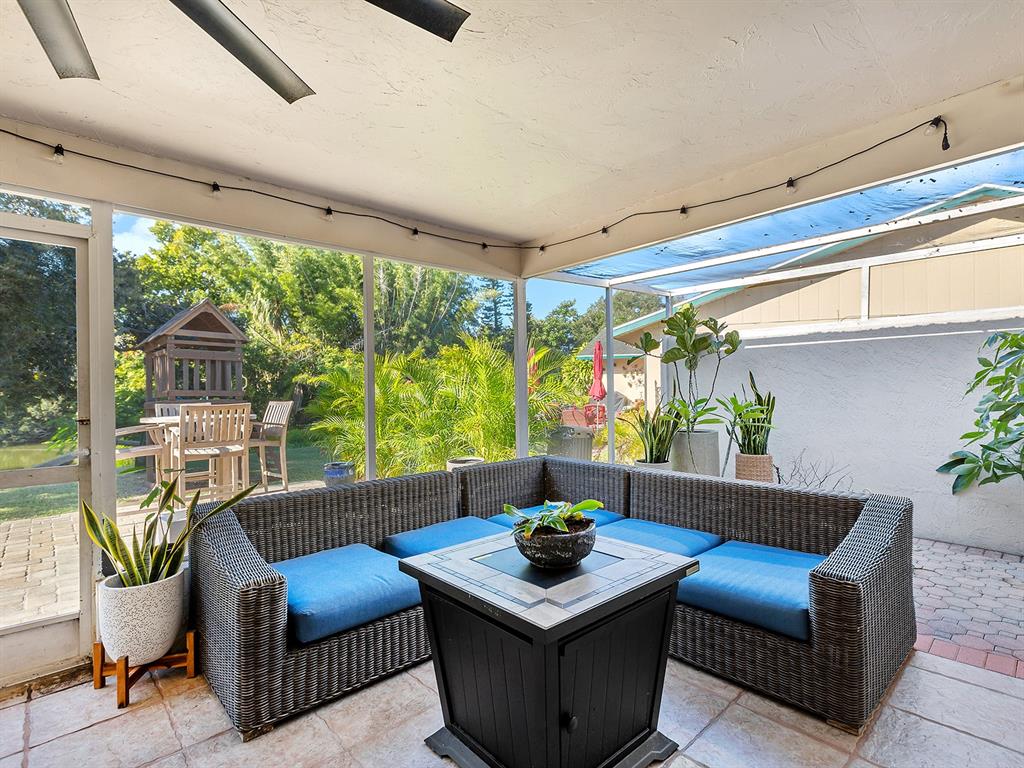 6502 Bikini Way Sarasota, FL 34241 - Photo 30 of 43 a living room with furniture and a potted plant