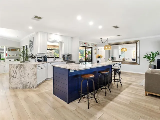 a room with a wooden cabinets and dining table