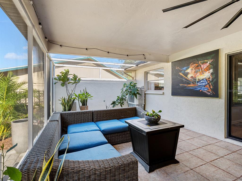 6502 Bikini Way Sarasota, FL 34241 - Photo 31 of 43 a living room with furniture and a potted plant
