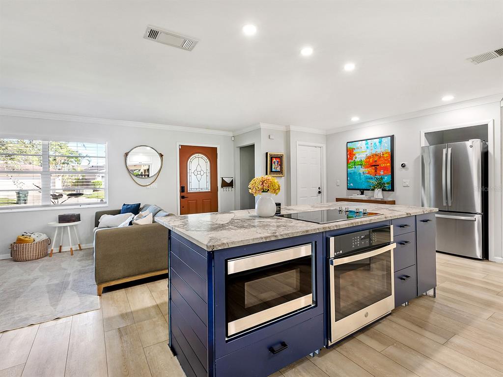 6502 Bikini Way Sarasota, FL 34241 - Photo 6 of 43 a kitchen with stainless steel appliances granite countertop a stove and a refrigerator