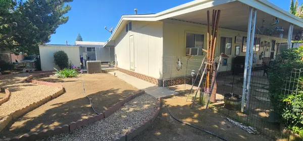 a view of a house with backyard