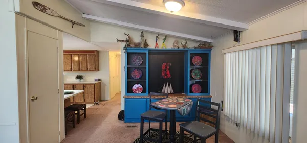 a view of a dining room with furniture window and fire pit