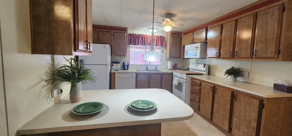 a kitchen with a table and chairs in it