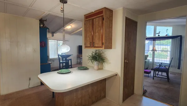 a kitchen with a table and chairs