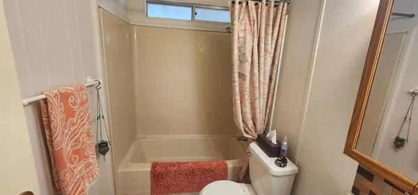 a bathroom with a shower curtain