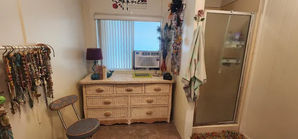 a bathroom with a sink a toilet and shower curtain