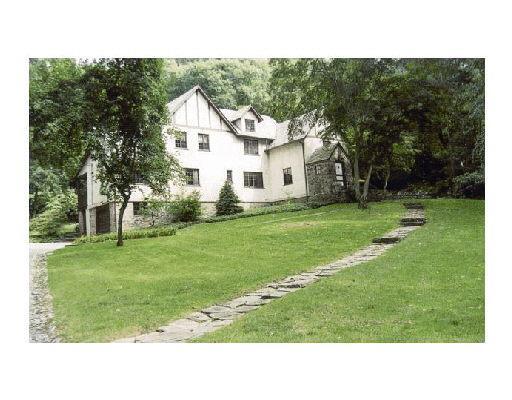 a black and white photo of a house