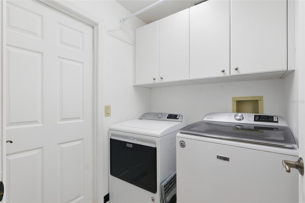 3488 Ridge Boulevard Palm Harbor, FL 34684 - Photo 25 of 30 a utility room with dryer and washer