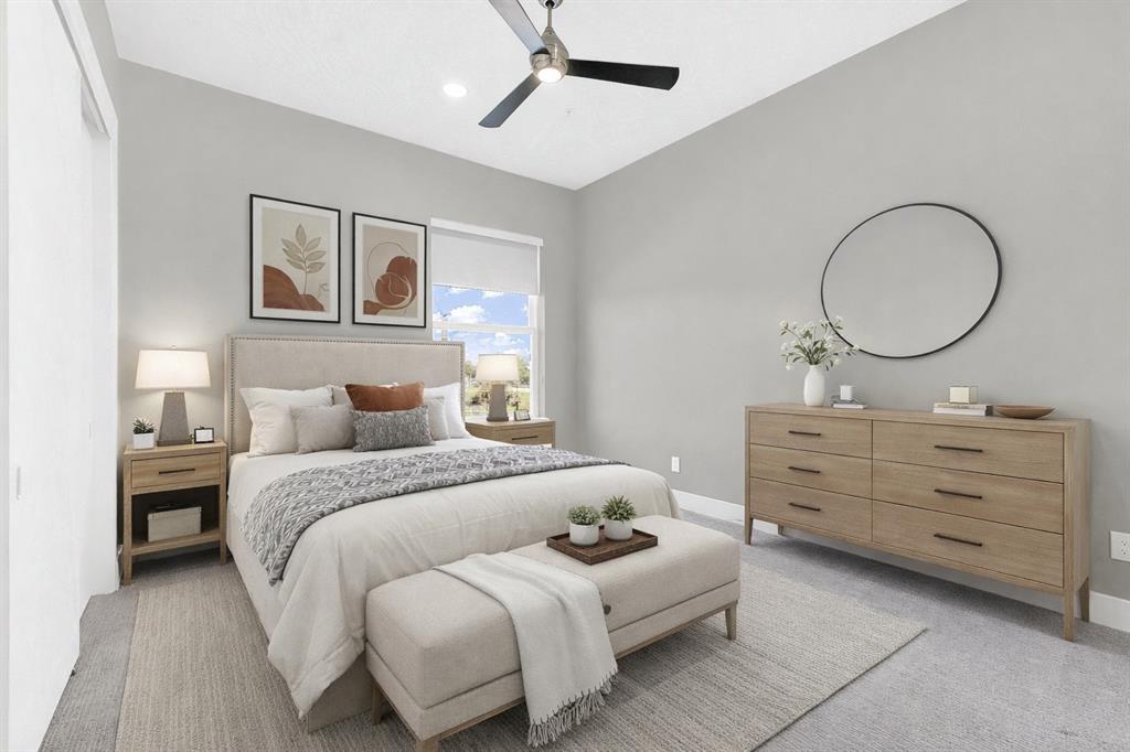 4060 Spring Valley Road, Unit 105 Farmers Branch, TX 75244 - Photo 15 of 19 a bedroom with a bed and a dresser