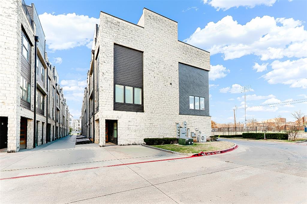 4060 Spring Valley Road, Unit 105 Farmers Branch, TX 75244 - Photo 19 of 19 a view of a white building among the street