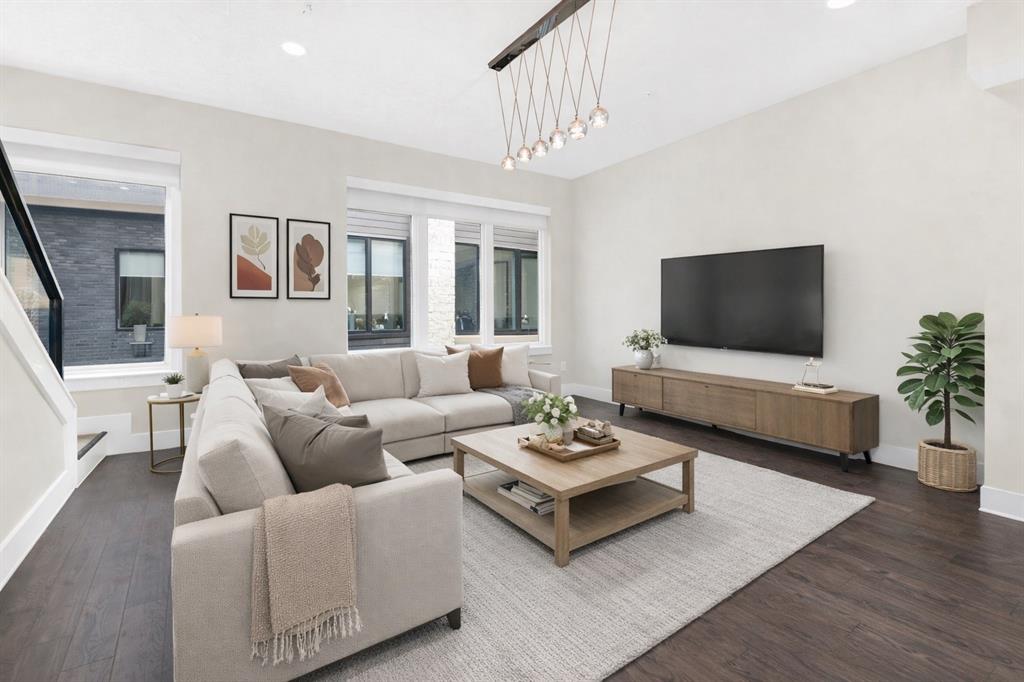 4060 Spring Valley Road, Unit 105 Farmers Branch, TX 75244 - Photo 2 of 19 a living room with furniture a flat screen tv and a dining table