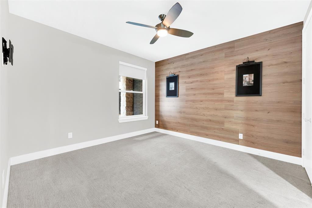 4060 Spring Valley Road, Unit 105 Farmers Branch, TX 75244 - Photo 8 of 19 a view of a livingroom with a ceiling fan
