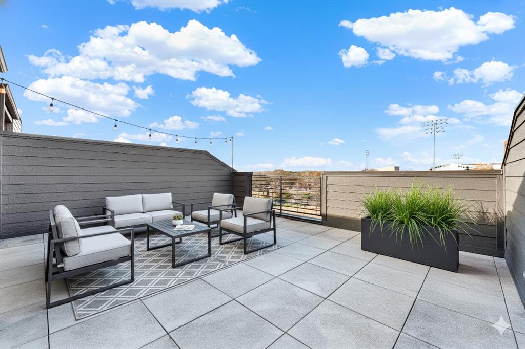 4060 Spring Valley Road, Unit 105 Farmers Branch, TX 75244 - Photo 9 of 19 a terrace with outdoor seating