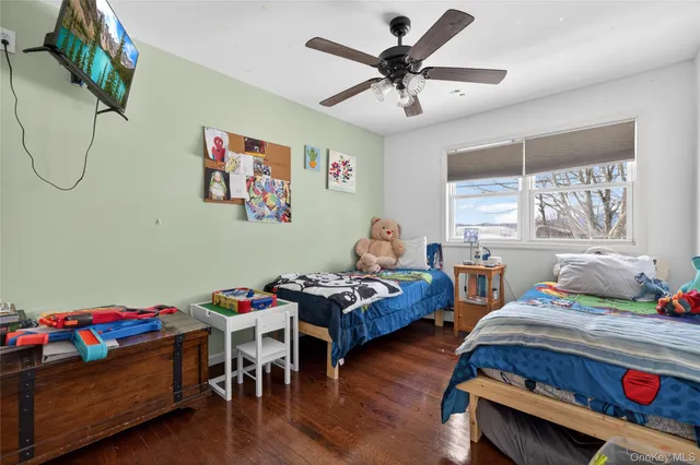 a bedroom with furniture and a window