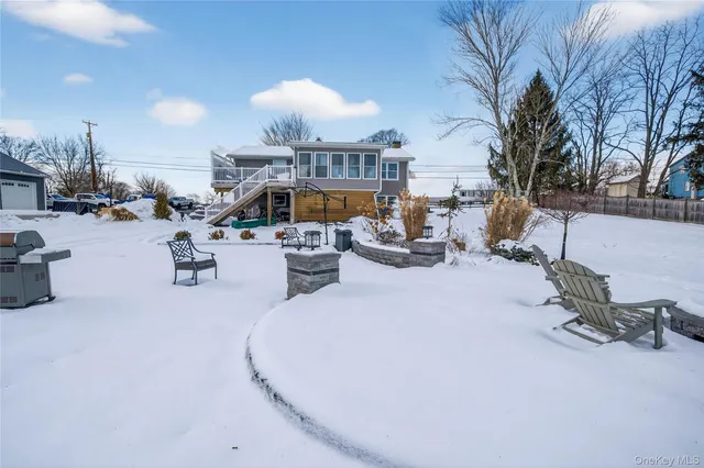 a living room with furniture a fireplace and a table