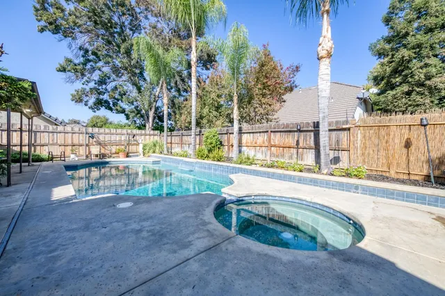 a view of swimming pool with a patio