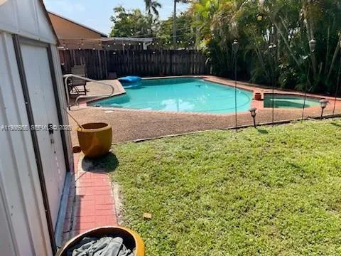 a view of a backyard with a swing