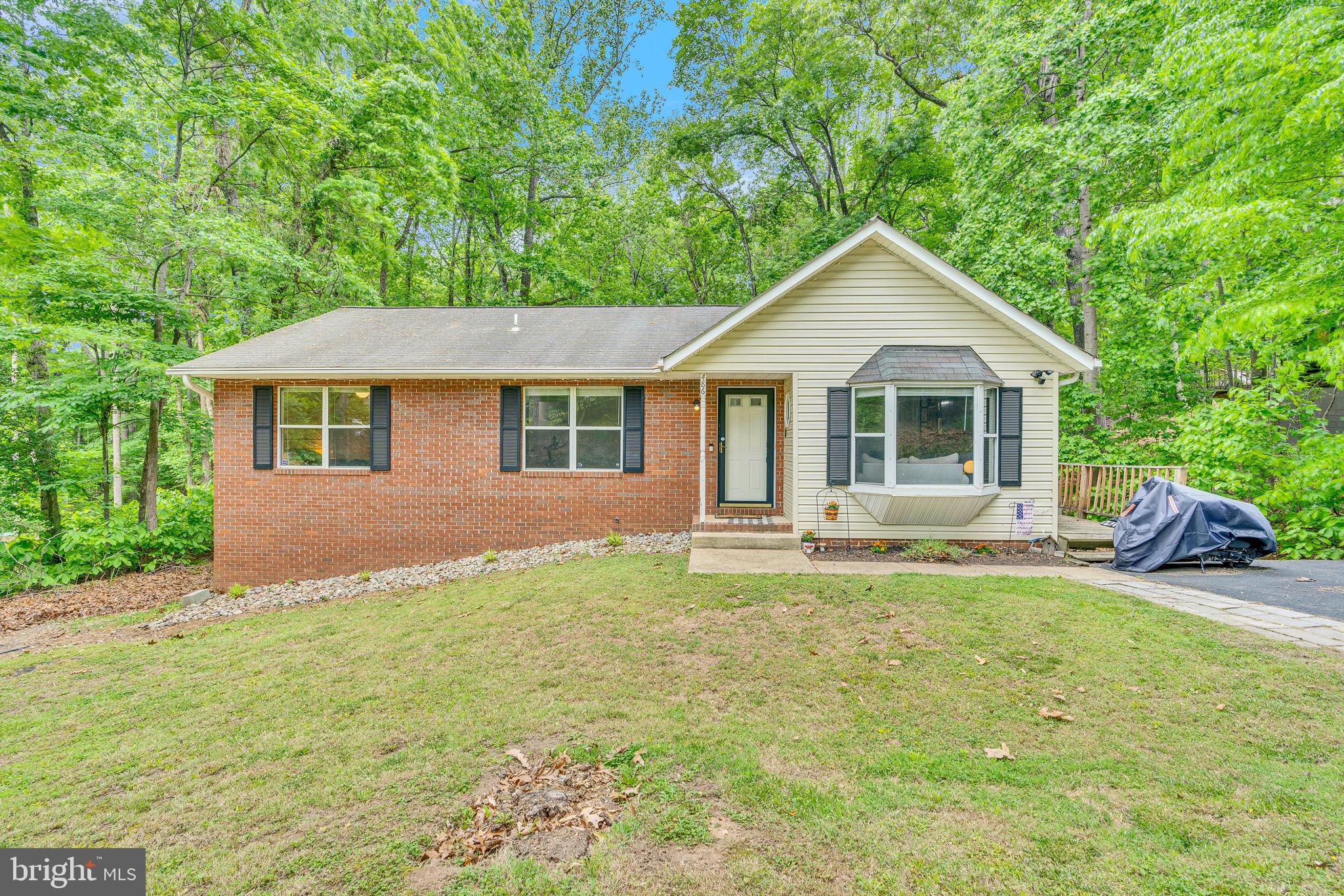486 Round Up Road Lusby, MD 20657 - Photo 1 of 31 a house view with a garden space
