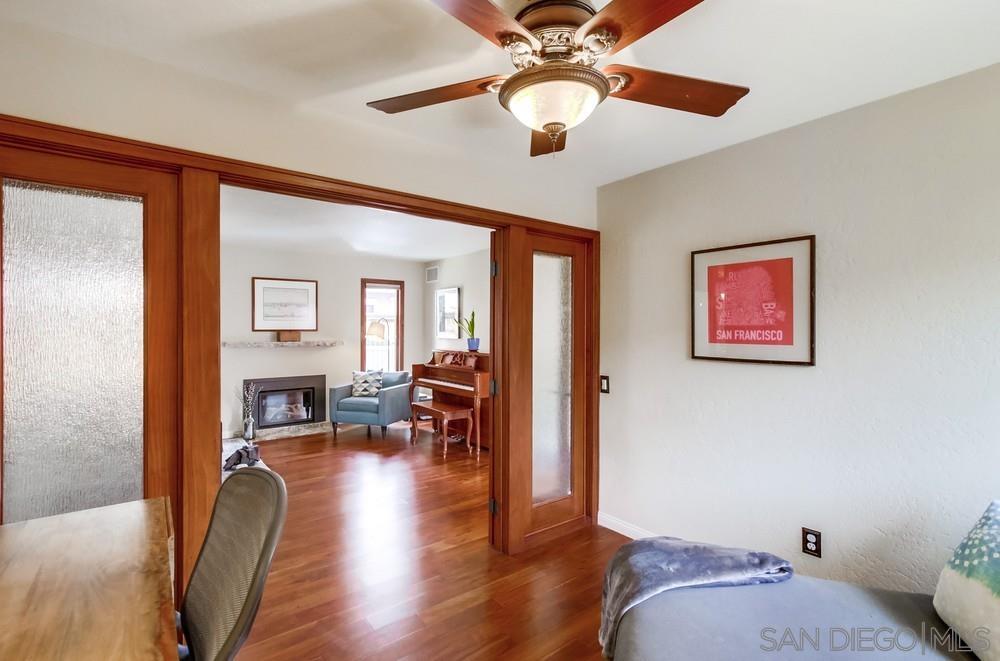 12128 Eagle Street San Diego, CA 92131 - Photo 20 of 37 a bedroom with furniture and a wooden floor