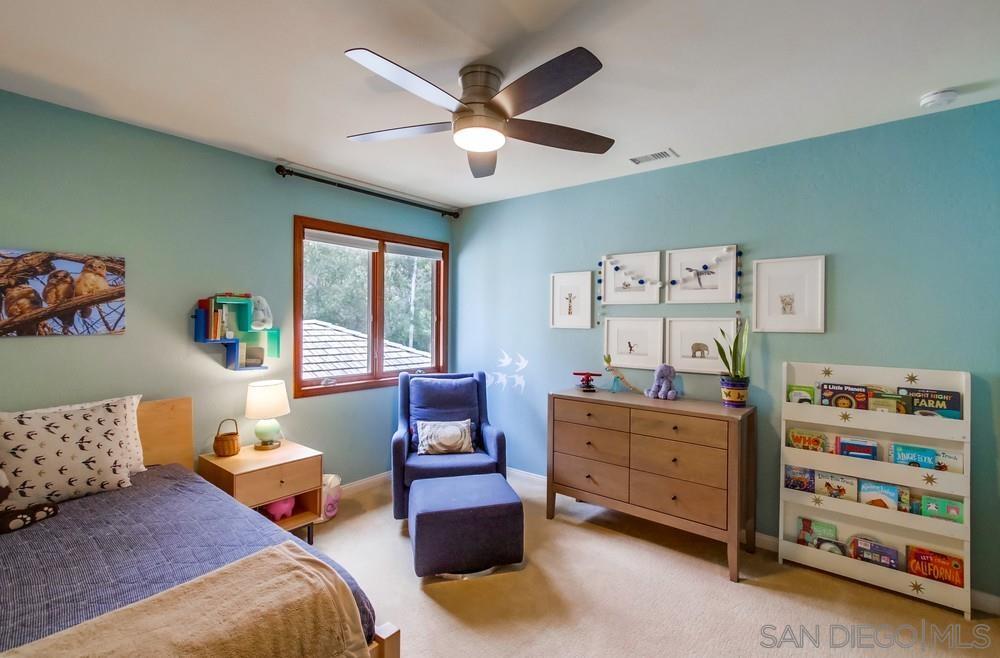 12128 Eagle Street San Diego, CA 92131 - Photo 25 of 37 a bed room with furniture and a window