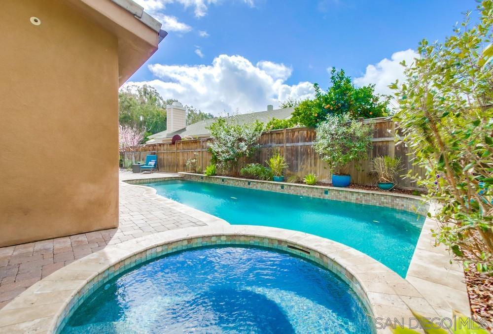 12128 Eagle Street San Diego, CA 92131 - Photo 32 of 37 a view of a swimming pool with an outdoor space