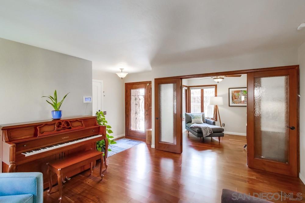 12128 Eagle Street San Diego, CA 92131 - Photo 4 of 37 a room with lots of furniture and wooden floor