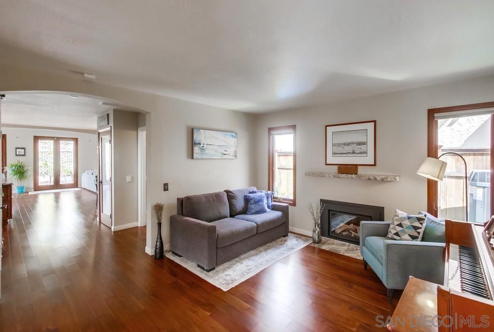 12128 Eagle Street San Diego, CA 92131 - Photo 6 of 37 a living room with furniture and a wooden floor